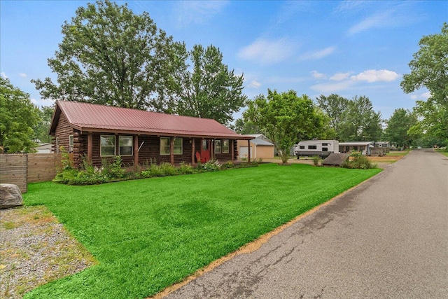 11350 Powhatan Path, Lakeview, OH 43331 - view of front of house featuring log siding and a metal roof