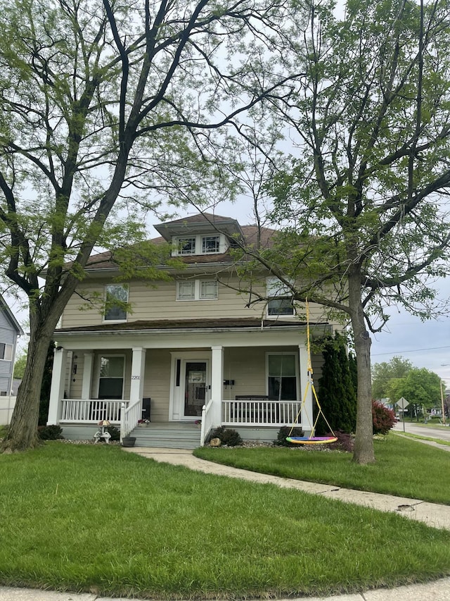 view of front of home featuring a porch and a front yard