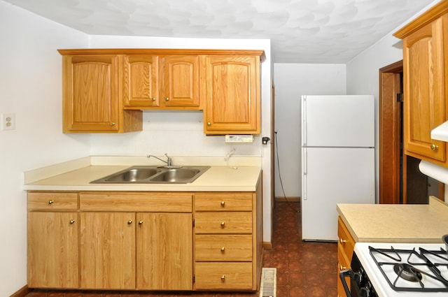 332 N Main St, New Madison, OH 45346 - kitchen with white appliances, a sink, and light countertops