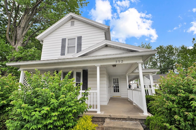 332 N Main St, New Madison, OH 45346 - view of front of home featuring a porch