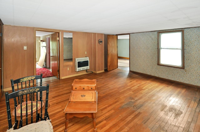 332 N Main St, New Madison, OH 45346 - living area with heating unit, hardwood / wood-style floors, and baseboards
