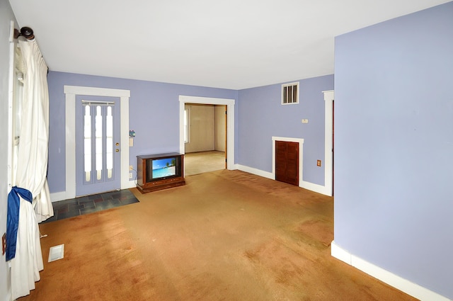 332 N Main St, New Madison, OH 45346 - carpeted entrance foyer featuring baseboards