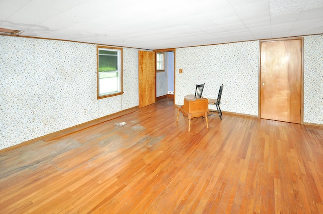 332 N Main St, New Madison, OH 45346 - interior space featuring wallpapered walls, wood finished floors, baseboards, and crown molding
