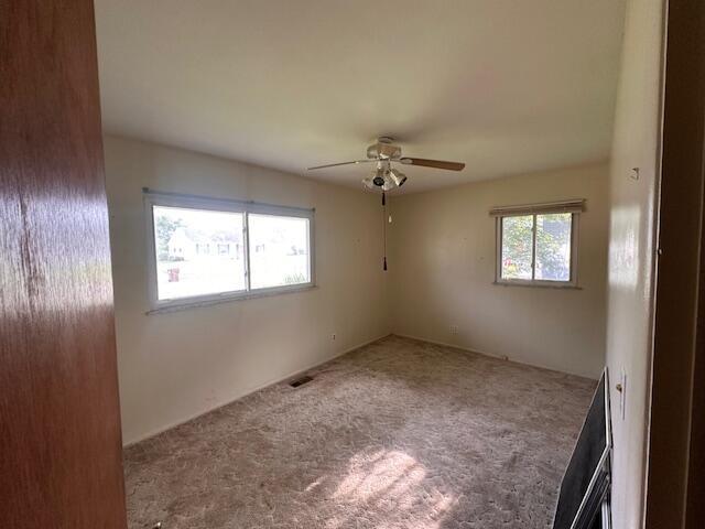 1432 Attleboro Ave, Springfield, OH 45503 - carpeted empty room with ceiling fan