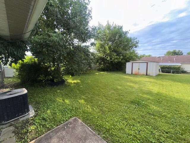 1432 Attleboro Ave, Springfield, OH 45503 - view of green lawn featuring a storage shed
