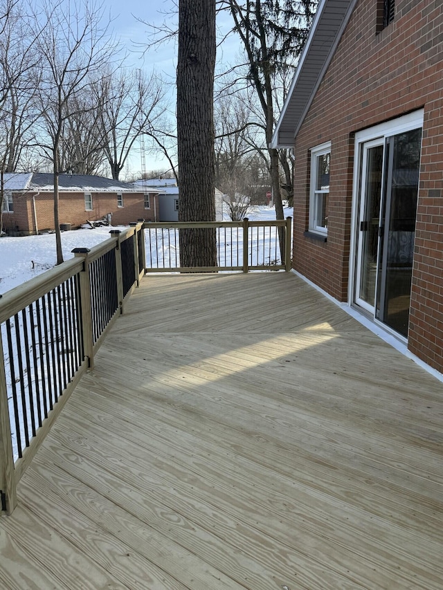 view of snow covered deck