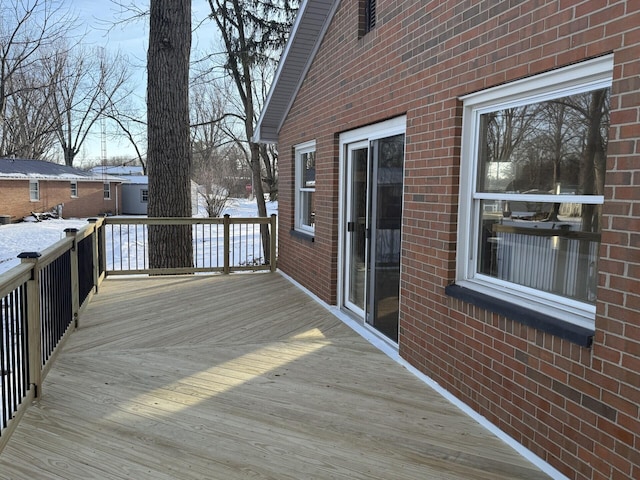 view of snow covered deck