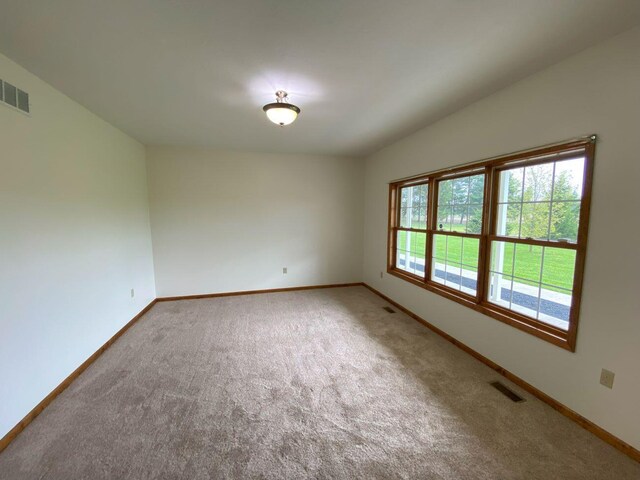4344 N US Highway 68, West Liberty, OH 43357 - carpeted spare room featuring visible vents and baseboards