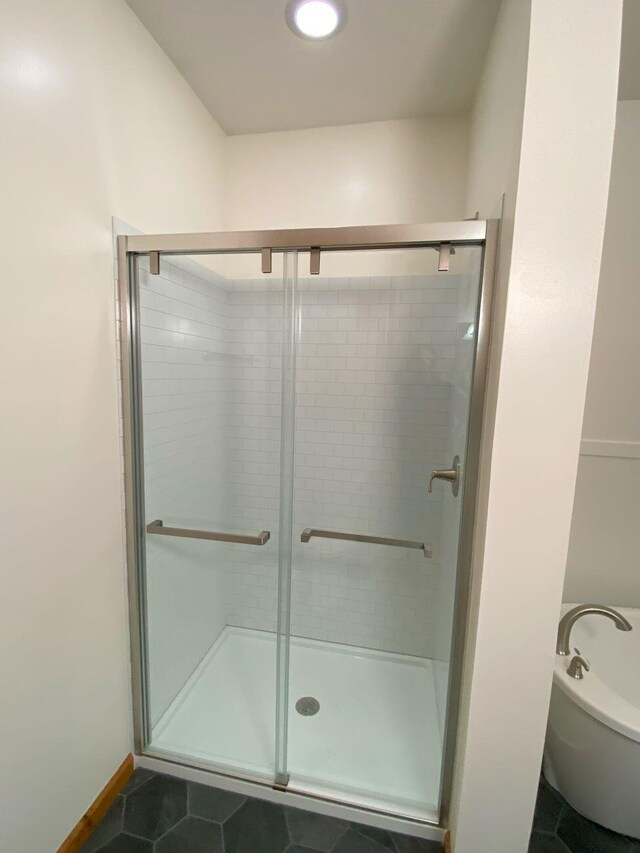 4344 N US Highway 68, West Liberty, OH 43357 - full bathroom with a stall shower, tile patterned flooring, and a bath