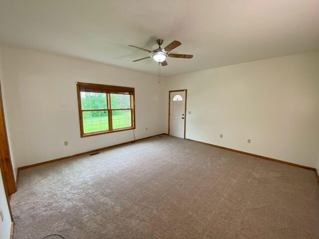 4344 N US Highway 68, West Liberty, OH 43357 - empty room featuring ceiling fan, carpet flooring, baseboards, and visible vents