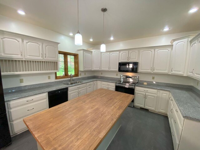 4344 N US Highway 68, West Liberty, OH 43357 - kitchen featuring a sink, black appliances, white cabinetry, a center island, and hanging light fixtures