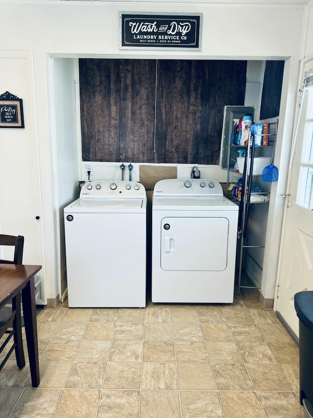 clothes washing area with laundry area and washing machine and dryer