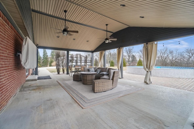 view of patio / terrace featuring an outdoor pool, an outdoor living space, and a ceiling fan