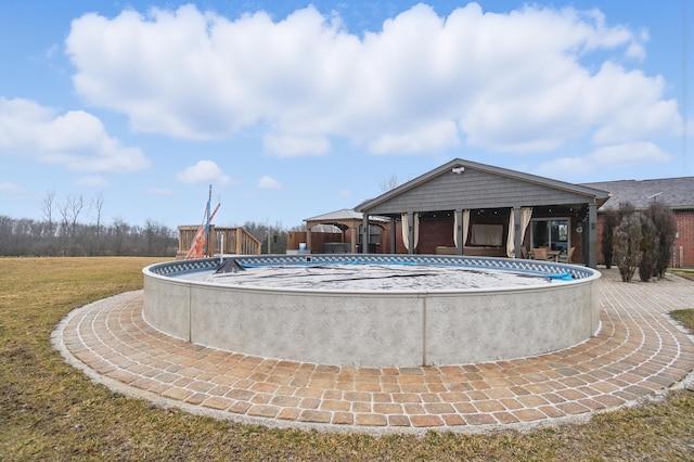 outdoor pool with a yard and a gazebo