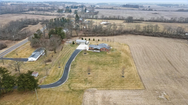 birds eye view of property with a rural view