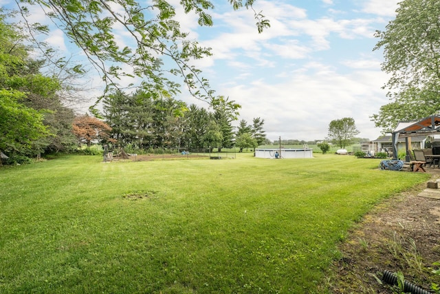 17689 Fort Loramie Swanders Rd, Sidney, OH 45365 - view of green lawn with an outdoor pool