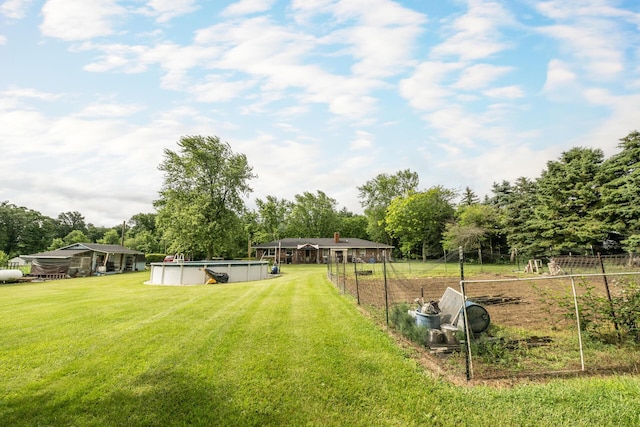 17689 Fort Loramie Swanders Rd, Sidney, OH 45365 - view of grassy yard featuring an outdoor pool and view of wooded area