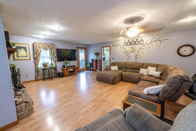 17689 Fort Loramie Swanders Rd, Sidney, OH 45365 - living area with a textured ceiling, wood finished floors, and ceiling fan