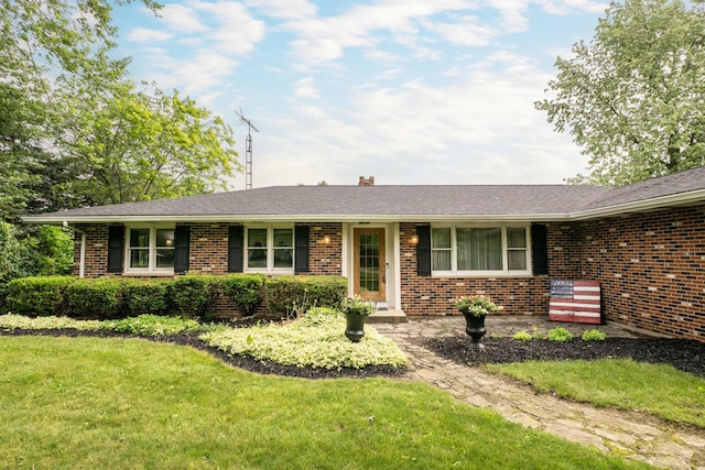 17689 Fort Loramie Swanders Rd, Sidney, OH 45365 - ranch-style house with brick siding, a front yard, a chimney, and roof with shingles