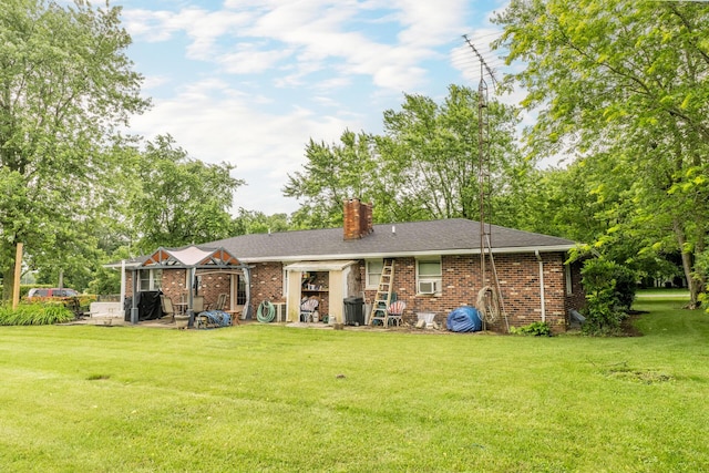 17689 Fort Loramie Swanders Rd, Sidney, OH 45365 - back of property featuring a patio area, a chimney, a yard, and brick siding