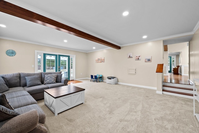 living room featuring beam ceiling, crown molding, baseboards, and light carpet