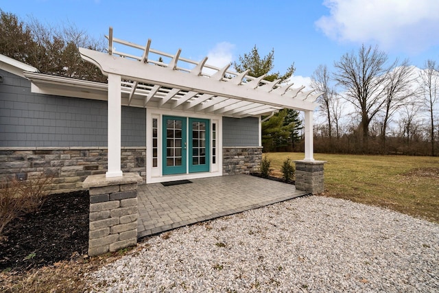 view of patio featuring french doors and a pergola