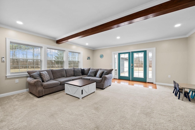 living room with crown molding, beamed ceiling, light colored carpet, and baseboards