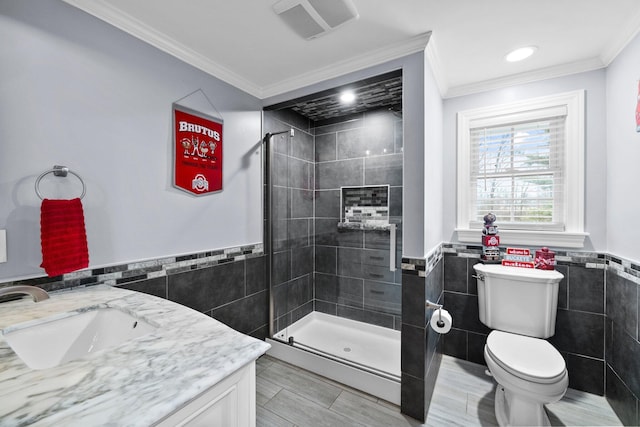 full bath with visible vents, toilet, ornamental molding, tile walls, and tiled shower