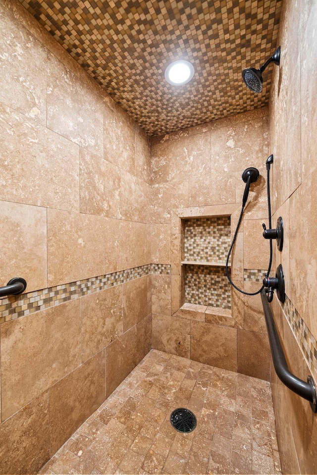 bathroom featuring tiled shower