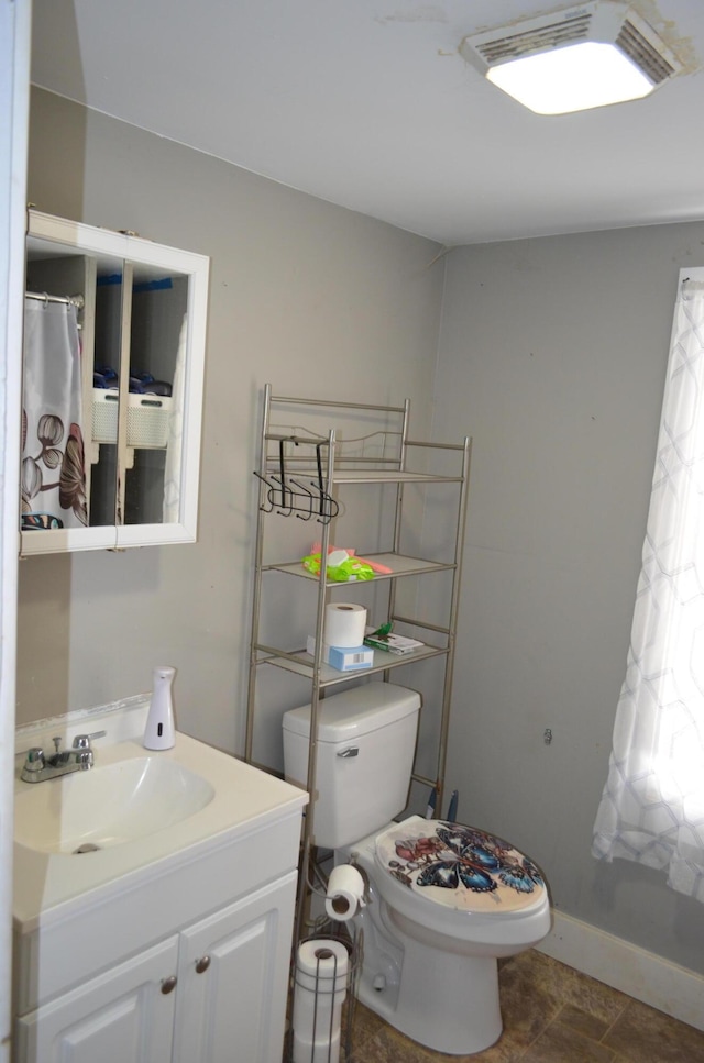 1170 Selma Rd, Springfield, OH 45505 - bathroom featuring visible vents, toilet, vanity, and baseboards