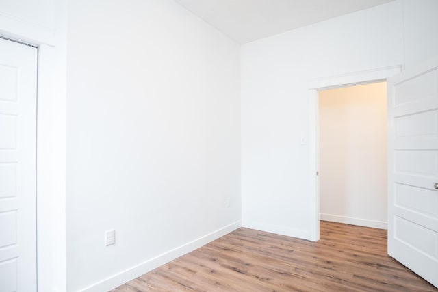 empty room with wood-type flooring