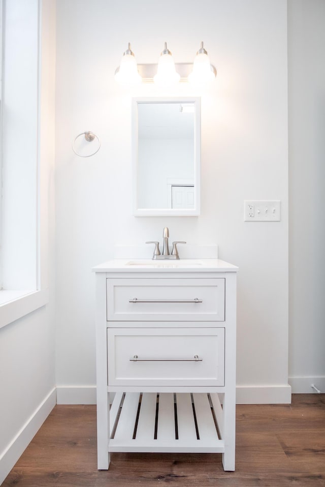 bathroom featuring vanity and wood-type flooring