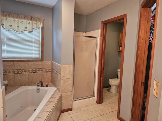 6822 Watercraft Dr, Huntsville, OH 43324 - full bathroom featuring tile patterned floors, a shower stall, and a whirlpool tub