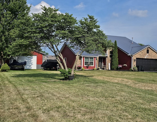 6822 Watercraft Dr, Huntsville, OH 43324 - ranch-style home with a front lawn and an attached garage