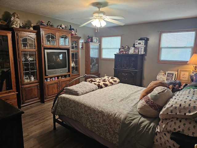 6822 Watercraft Dr, Huntsville, OH 43324 - bedroom featuring dark wood finished floors and a ceiling fan