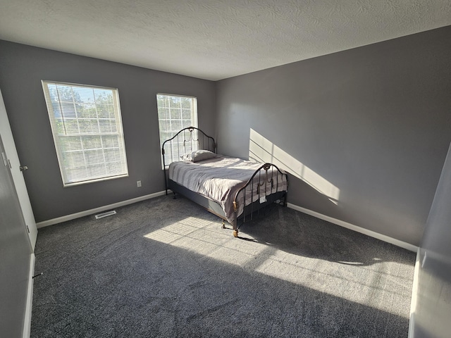 2973 Kicking Bird Trce, Dublin, OH 43017 - bedroom featuring carpet and a textured ceiling