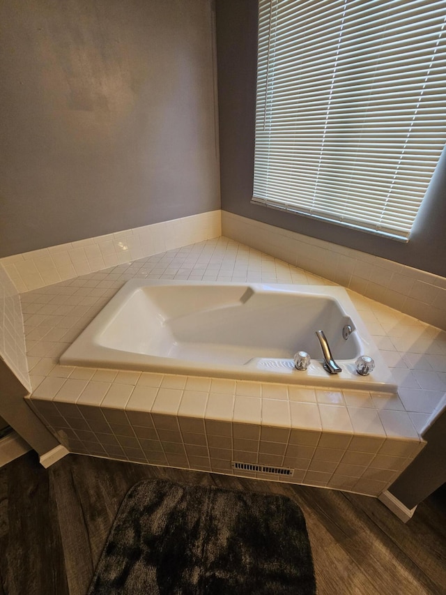 2973 Kicking Bird Trce, Dublin, OH 43017 - full bathroom featuring a bath and wood finished floors