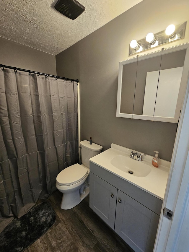 2973 Kicking Bird Trce, Dublin, OH 43017 - bathroom featuring wood finished floors, a textured ceiling, and vanity