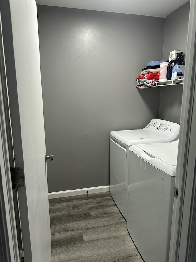 2973 Kicking Bird Trce, Dublin, OH 43017 - laundry room featuring washing machine and dryer and wood finished floors