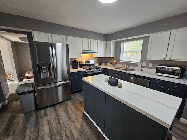 2973 Kicking Bird Trce, Dublin, OH 43017 - kitchen with appliances with stainless steel finishes, dark wood-style floors, light countertops, and white cabinetry