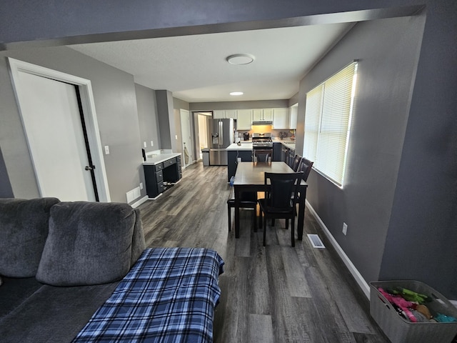 2973 Kicking Bird Trce, Dublin, OH 43017 - dining area with dark wood finished floors and baseboards