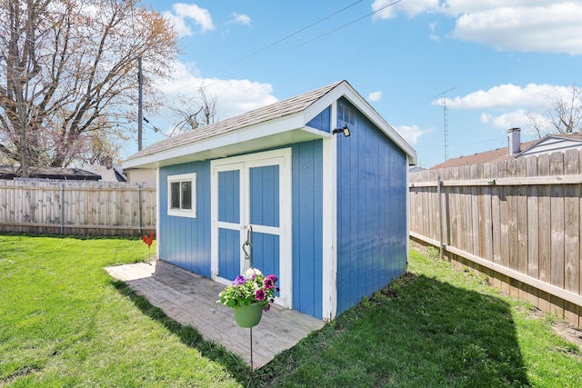view of shed with a fenced backyard
