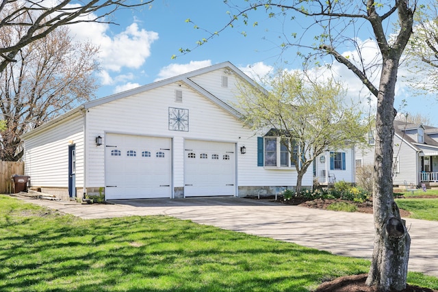 ranch-style home with an attached garage, driveway, and a front lawn