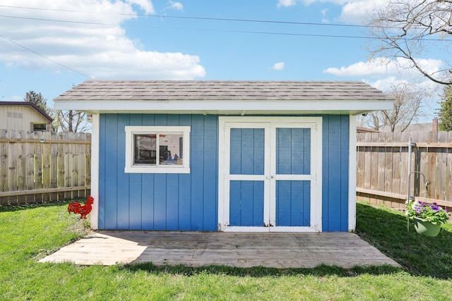 view of shed with a fenced backyard