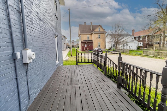 wooden deck featuring a residential view