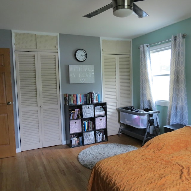 1084 Colonial Dr, Sidney, OH 45365 - bedroom with multiple closets, wood finished floors, and a ceiling fan