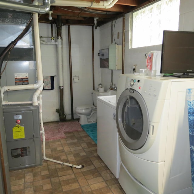 1084 Colonial Dr, Sidney, OH 45365 - laundry room featuring independent washer and dryer and heating unit