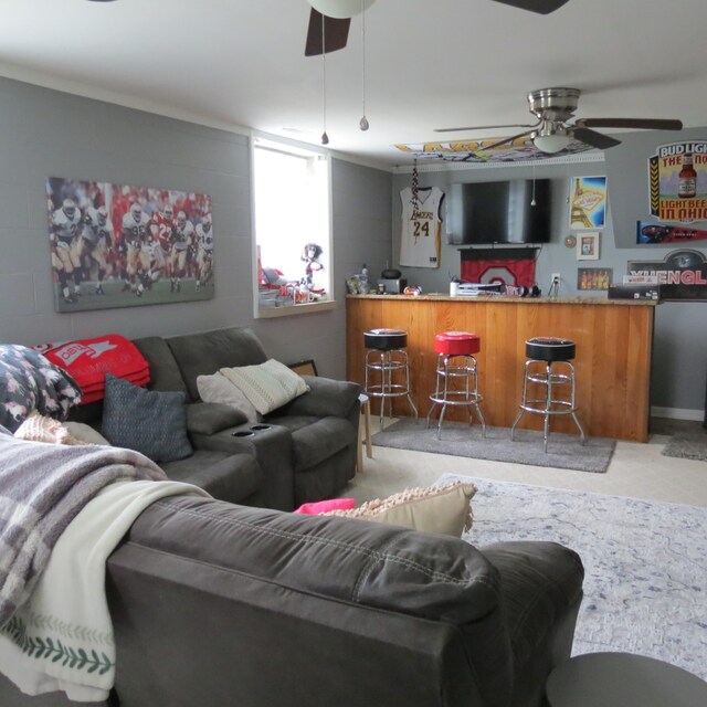 1084 Colonial Dr, Sidney, OH 45365 - carpeted living room featuring bar area and ceiling fan