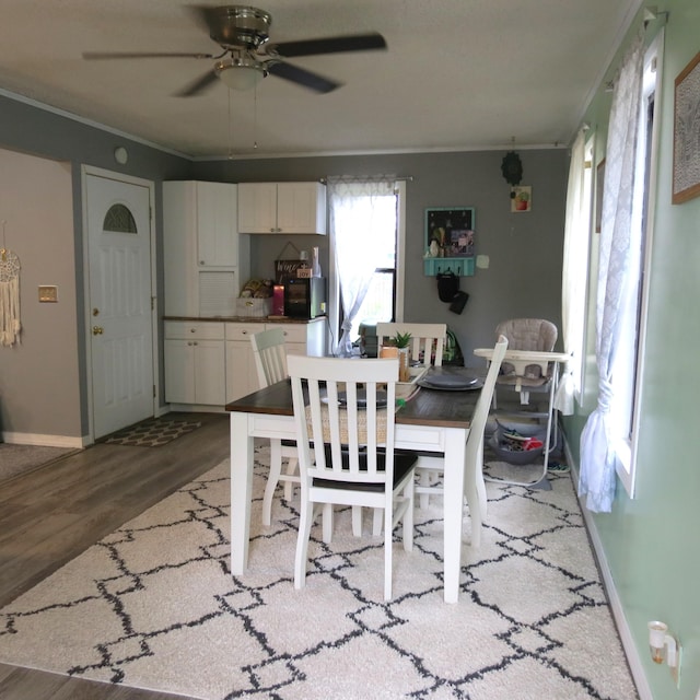 1084 Colonial Dr, Sidney, OH 45365 - dining room featuring ornamental molding, ceiling fan, and wood finished floors