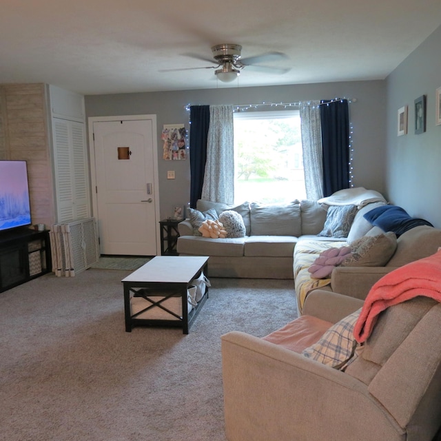 1084 Colonial Dr, Sidney, OH 45365 - carpeted living area with ceiling fan